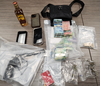 OPP charge two and seize drugs, a handgun, cash