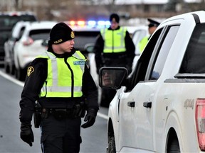 Middlesex OPP set up a RIDE checkpoint on the Highway 402 off-ramp at Colonel Talbot Road on Thursday, Nov. 17, 2022, to kick off the annual holiday campaign against impaired driving. (Dale Carruthers/The London Free Press)