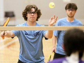 Travis Caron, left, and Colin St. Pierre of Pain Court play in the boys' doubles final at the LKSSAA South senior badminton qualifier at St. Clair College's Chatham Campus HealthPlex in Chatham, Ont., on Tuesday, April 9, 2024. Mark Malone/Chatham Daily News/Postmedia Network