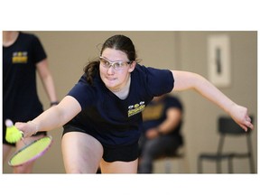 Jeanette Legere of Chatham-Kent reaches for a backhand in the girls' doubles final at the LKSSAA South senior badminton qualifier at St. Clair College's Chatham Campus HealthPlex in Chatham, Ont., on Tuesday, April 9, 2024. Mark Malone/Chatham Daily News/Postmedia Network