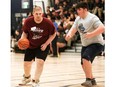 McGregor Panthers' Ethan Jeaneau-Seed, left, is guarded by Ursuline Lancers' Christian Konstantinou during a basketball qualifying tournament for the Special Olympics Ontario School Championship Games at Ursuline College Chatham in Chatham, Ont., on Friday, April 26, 2024. Mark Malone/Chatham Daily News/Postmedia Network