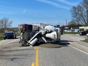 A concrete truck lies on its side on Talbot Road east of Aylmer after it collided with a pickup truck on Thursday, April 25, 2024. (Elgin OPP photo)