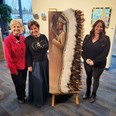 Mayor Katchur, Ellie Lagrandeur and Stacey Shearing pose with the Art in Public Places piece.