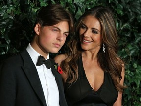 British actress Elizabeth Hurley, right, and her son Damian pose on the red carpet as they attend the 62nd London Evening Standard Theatre Awards in London on Nov. 13, 2016.