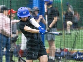 Noah Kavanagh of the U14 Strathroy Royals hits inside a batting cage at Centrefield Sports in London on Sunday April 14, 2024. (Derek Ruttan/The London Free Press)