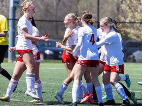 Saunders Sabres players celebrate after scoring in a TVRA girls soccer game against the Banting Broncos at City Wide Sports Park in London on Monday, April 22, 2024. (Derek Ruttan/London Free Press)