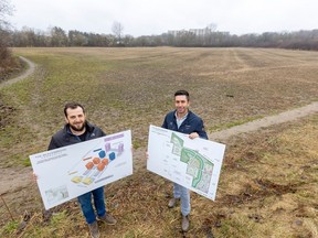 Jonathan and Jacob Katz stand in a field with Proudfoot Lane in the distance behind them. They're proposing 3,800 homes in a $1-billion development that could reshape part of northwest London. Photo taken on March 27, 2024. (Mike Hensen/The London Free Press)