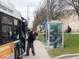 Students board an LTC bus at a stop at Clarke Road secondary school in London on Wednesday, April 24, 2024. (Mike Hensen/The London Free Press)