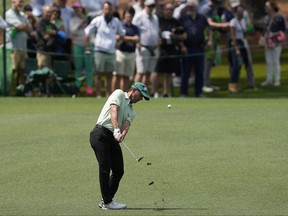Mike Weir of Bright's Grove, Ont., hits from the fairway on the second hole during the first round at the Masters golf tournament at Augusta National Golf Club Thursday, April 11, 2024, in Augusta, Ga. (AP Photo/David J. Phillip)
