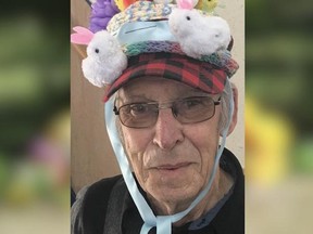 An senior citizen wearing decorated hat