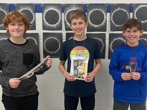 Bloomsburg Public School students Nolan Howe, Kurtis Bergen and Owen Wagenaar have made contributions to the school's collection of solar eclipse glasses, which will be donated to Astronomers Without Borders for distributions to countries around the world. SUBMITTED