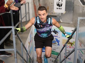 Tyler Kruschenske of Brantford crosses the finish line during the WWF Canada CN Tower Climb for Nature on Sunday April 21, 2024 in Toronto.