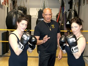 Twins Karissa, left, and Kat Strain, are launching a free boxing pilot project for girls age 13 to 16, beginning the first Sunday in May called Soul Strong with The Sisters Strain. The program is being held at KAYO Boxing Club thanks to owner Floyd Porter, centre. (Ellwood Shreve/Chatham Daily News)