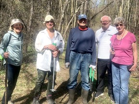 Chatham-Kent Trails Council volunteers Annie Tesligte, left, Bev VanDyken, John Cofell, Stan Jackson and Mari Cole mark trails recently at the 31-hectare Reynold's Tract woodlot, which is open to the public to explore. (Supplied)
