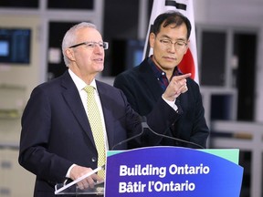 More big EV investment announcements on the horizon: Ontario Minister of Economic Development, Job Creation and Trade Vic Fedeli speaks during a press conference in Windsor on April 11, 2024, as Chunbok Choi, CEO of DS Actimo Canada Inc., looks on.