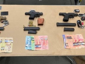 Three loaded handguns with extra magazines and over $18,000 in Canadian currency were seized by Toronto Police after the investigation two armed carjackings in that were five days apart.