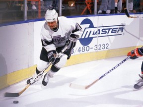Forward Jimmy Fox (14) is seen in action with the NHL's Los Angeles Kings in 1989.