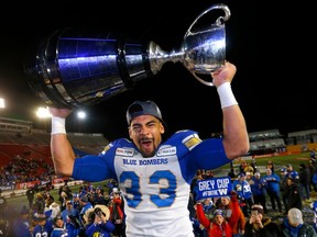 Winnipeg Blue Bombers, Andrew Harris hoists the Grey Cup after beating the Hamilton Tiger-Cats in the 107th Grey Cup at McMahon stadium in Calgary on Sunday, November 24, 2019.