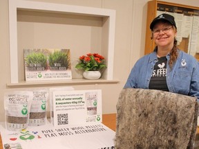 Guest speaker Jennifer Osborn poses with her display of waste wool pellets and landscape fabric at the Ripley and District Horticultural Society meeting held April 17. Christine Roberts photo
