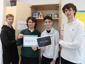 Coady Davies, left, Xzavier Toogood, Jaxon Hudie and Carter Lambert, all Grade 12 students taking a business leadership class at St. Patrick's secondary school in Sarnia, organized Patty's Pantry, a food cupboard for students to help families dealing with food insecurity.