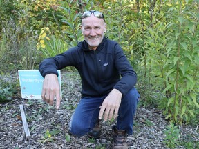 Mike Smalls is shown in a pollinating garden at his home in Sarnia.