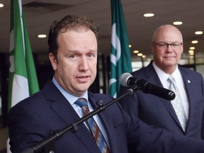 Associate Minister of Housing Rob Flack, right, looks on as Greater Sudbury Mayor Paul Lefebvre makes a point at an announcement at Tom Davies Square in Sudbury, Ont. on Friday April 5, 2024. Ontario is providing the City of Greater Sudbury with $1,520,000 in funding through the Building Faster Fund. John Lappa/Sudbury Star/Postmedia Network