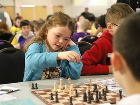 Kenzi Bradley, 9, of Northeastern Elementary School, takes part in an elementary school chess tournament at the Steelworkers hall in Sudbury, Ont. on Thursday April 11, 2024. About 240 Rainbow District School Board students from Grade 1 to 8 participated in the board's annual chess tournament. A total of 13 schools were represented. John Lappa/Sudbury Star/Postmedia Network