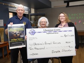 Ukrainian Centre board members Taras Martyn and Sandra Sharko, and Kathy Hall, branch manager of the Ukrainian Credit Union, take part in a cheque presentation at the centre in Sudbury, Ont. on Thursday April 11, 2024. A total of $10,000 was raised through the Ukrainian CentreÕs pyrohy fundraiser for Ukraine. The funds will go to the Ukrainian Credit Union Helps Ukraine fundraising program. The money will then be used to purchase drones for Ukraine. John Lappa/Sudbury Star/Postmedia Network