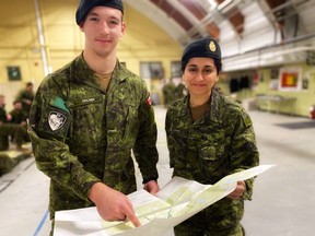 Proud to serve: 2nd Irish reservists Ptv. Kaleb Decaen and 2nd Lt. Madiha Khan illustrate the importance of navigating not just the landscape but life. Most weekends from September to summer the amoury on Riverside Drive is busy with training, including orienteering. Hugh Kruzel photo