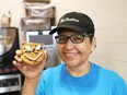 Hilda Wemigwans, of the Lasalle Tim Hortons in Sudbury, Ont., displays a cookie prepared for Tim Hortons annual Smile Cookie campaign. Cookies are $1.50 each with 100 per cent of the proceeds raised locally supporting charities such as the Sudbury Food Bank, Health Sciences North and the children's Christmas telethon. Smile Cookie Plushies are also available for $5, with $2 being donated to the campaign. The campaign wraps up May 5. John Lappa/Sudbury Star/Postmedia Network