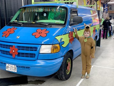 The Mystery Machine, of Scooby-Doo fame, earned second billing at the 2024 Northern Ontario Expo at the McIntyre Arena. Eight-year-old Alyssa Polson, of Timiskaming First Nation and dressed as the crime-solving mutt, checked it out on Saturday. THOMAS PERRY/THE DAILY PRESS