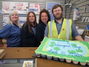 The Port Rowan post office celebrated the launch of two new Canada Post stamps Monday featuring the endangered Oregon spotted frog and Fowler's toad with an open house and cupcake cake. From left are Port Rowan staff Trish Radusin, Sue Ashton, Erin Zakel, and postmaster Christopher La Berge. CHRIS ABBOTT