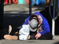 A drug user is pictured in the Downtown Eastside of Vancouver on Oct. 26, 2023.
