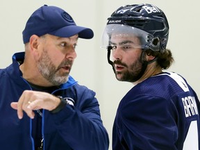 Colby Barlow (right) gets a word from Manitoba Moose assistant coach Eric Dubois at Winnipeg Jets rookie camp on Wed., Sept. 13, 2023. KEVIN KING/Winnipeg Sun