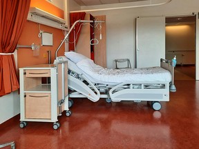 Stock image of an empty hospital bed. Timothy Huliselan/Pexels