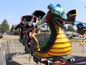 Elijah Hilts, top left, Tom Tran, top right, Willow, bottom left, and Johnny Lawlor were among the first to brave the Dragon Coaster at the Wild Rose Shows carnival in 2023. Whitecourt council approved street closures in the downtown core for the event to be staged again in May 2024.