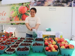 At the 2022 Whitecourt farmers market outside the Royal Canadian Legion, Nina San Juan of Red Apple B.C. Fruit offered fruit from the Okanagan Valley. On May 7, the Whitecourt farmers market will re-open at a new location, the curling rink at 70 Sunset Blvd. on the hilltop.