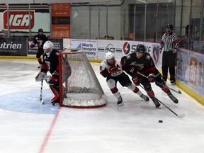 Whitecourt Wolverines player Nathaniel Bannister clashed with Camrose Kodiaks player Levi Carter during 2023-24 AJHL playoffs.