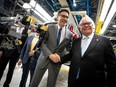 Prime Minister Justin Trudeau shakes hands with Ontario Premier Doug Ford during an announcement at the Honda of Canada Manufacturing Plant 2 in Alliston on April 25 that the Japanese automaker will invest $15 billion to make electric vehicles in Ontario. (PETER POWER/AFP via Getty Images)