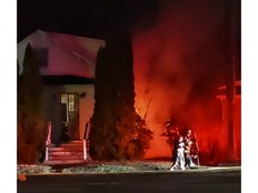 Firefighters battle a house fire on St. George Boulevard in Moncton on April 15.