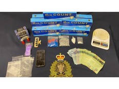 Drugs, cash and items seized by police in Greater Lakeburn on Feb. 16, 2021.
