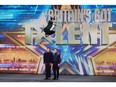 Burton's Duncan Murray pogoing over two people at Britain's Got Talent audition.