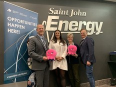 Saint John Energy CEO Ryan Mitchell, Kraken Technologies vice-president Lily Stein,  Saint John Mayor Donna Reardon and Saint John-Rothesay MP Wayne Long hold stuffed Krakens