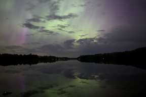 The Northern Lights illuminate the sky over Sydenham Lake