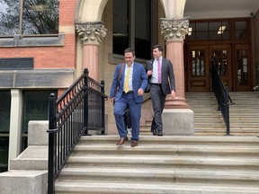 Benjamin Perryman and Adam Goldenberg exit the Fredericton courthouse.