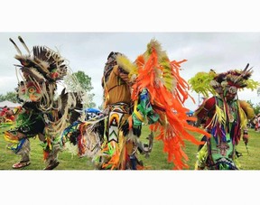 Dancers make their entrance during the spring powwow at Walpole Island First Nation on Saturday. (Trevor Terfloth/The Chatham Daily News)