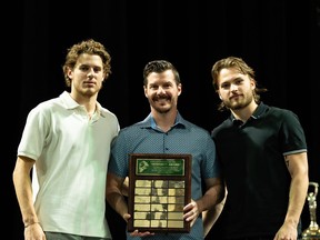 London Knights forward and Sudbury product Max McCue, left, received the team's Intensity Award along with teammate Alec Leonard, right, from associate general manager Rob Simpson during the Knights' championship celebration on Saturday. The award is "presented annually to the player most dedicated to conditioning, for most improved, positive attitude and consistent effort.” McCue also shared the Don Brankley Community Service Award with Landon Sim. London won the OHL championship over the Oshawa Generals last week.
