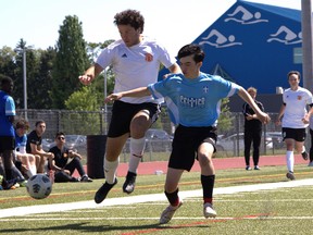 North Park Collegiate’s Christian Alagna chases the ball against Bishop Macdonell Catholic High School on Thursday at Bisons Alumni North Park Sports Complex during the CWOSSA AA boys soccer final. Brian Smiley