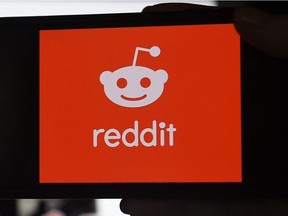 This photo illustration shows the logo of Reddit on a mobile phone in Arlington, Virginia o