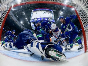 Arturs Silovs #31 of the Vancouver Canucks makes a save against Dylan Holloway #55 of the Edmonton Oilers during the third period in Game One of the Second Round of the 2024 Stanley Cup Playoffs at Rogers Arena on May 8, 2024 in Vancouver, British Columbia, Canada.